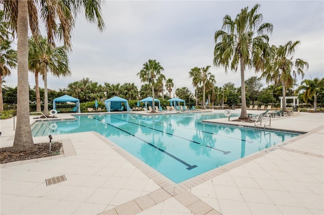 view of pool with a patio area and a gazebo