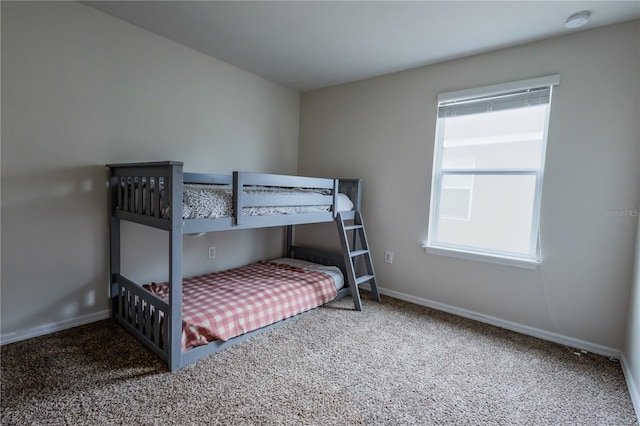 carpeted bedroom with multiple windows