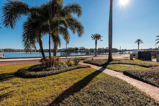 exterior space with a yard and a water view