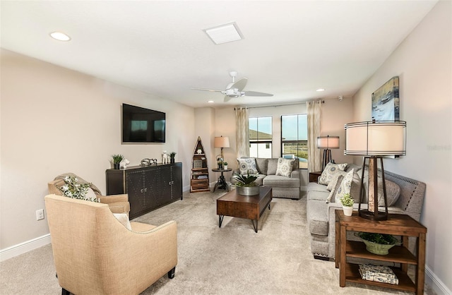 living room with light carpet and ceiling fan