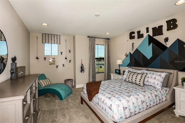 bedroom with carpet flooring and a textured ceiling