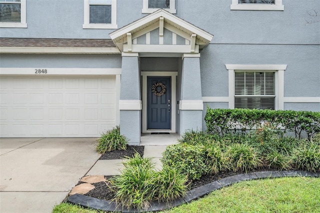 property entrance with a garage