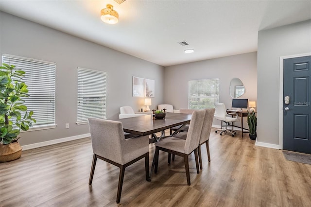 dining room with hardwood / wood-style flooring