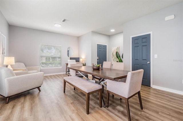 dining space featuring light hardwood / wood-style floors