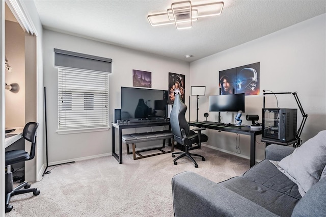 office with a textured ceiling and light colored carpet