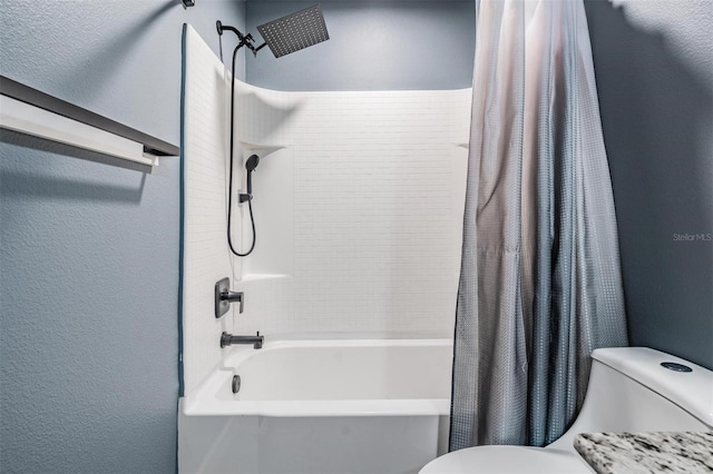 bathroom featuring toilet and shower / bath combination with curtain