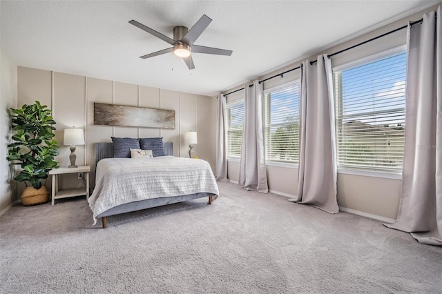 bedroom with ceiling fan and carpet flooring