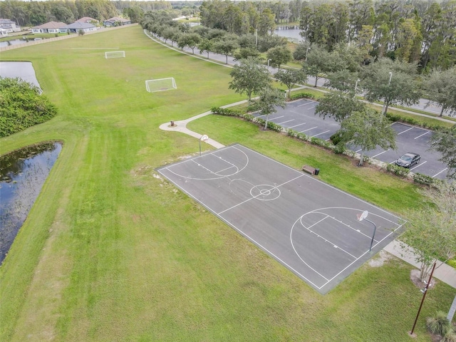 view of basketball court featuring a water view