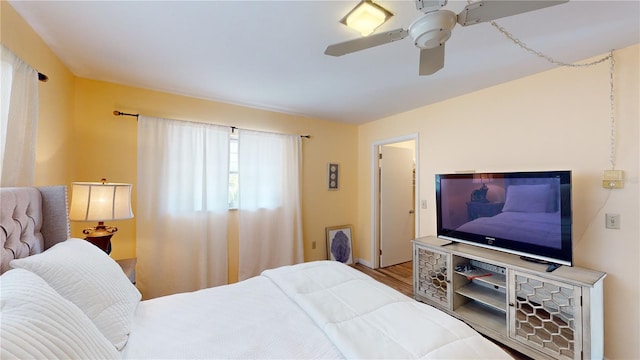 bedroom featuring ceiling fan and wood-type flooring