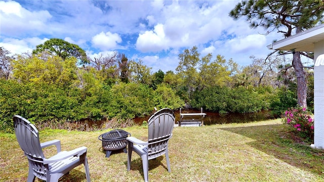 view of yard featuring a fire pit