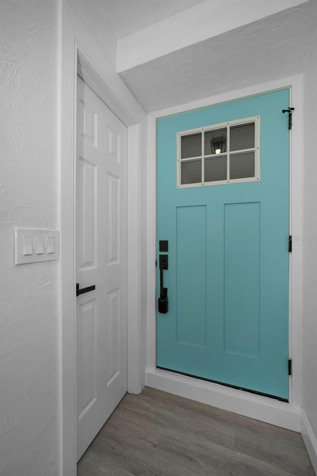 doorway to outside featuring hardwood / wood-style flooring