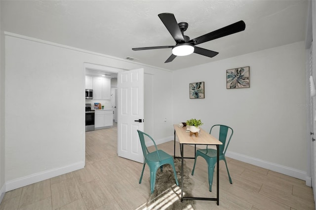 dining room featuring ceiling fan