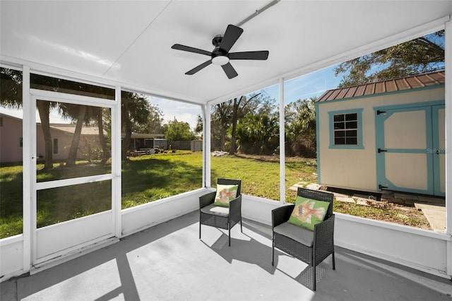 sunroom featuring ceiling fan