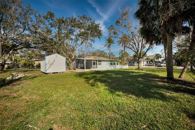 402 Pineapple St, Tarpon Springs, FL 34689 - view of yard featuring a sunroom, an outdoor structure, and a shed