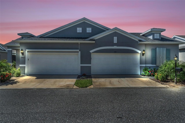 view of front of property with a garage