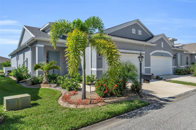 view of front of property with a front lawn and a garage