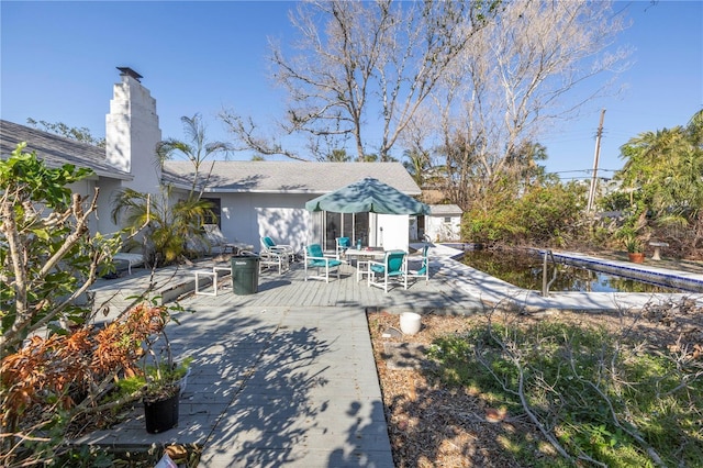 rear view of property featuring a patio area