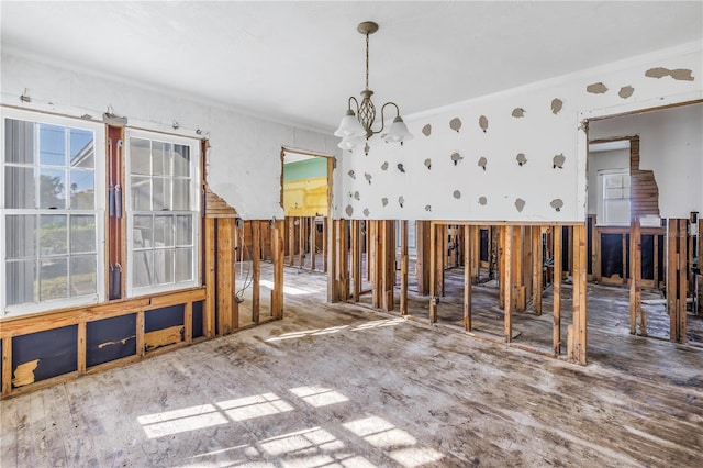 interior space featuring ornamental molding and a chandelier