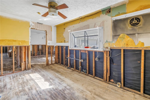 misc room featuring ceiling fan and hardwood / wood-style flooring