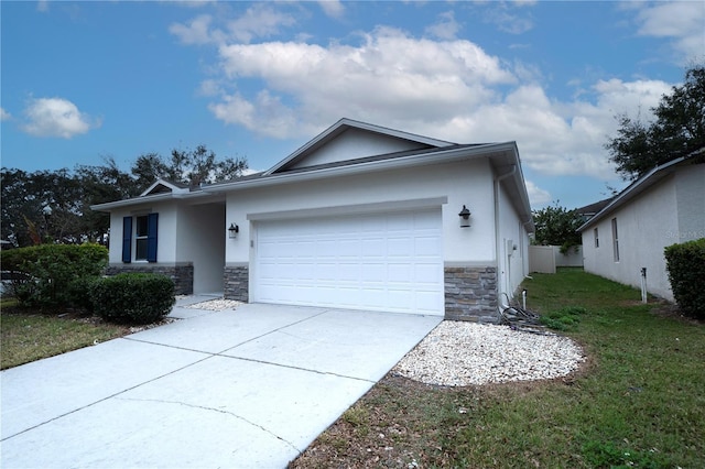 view of front of property featuring a front yard and a garage