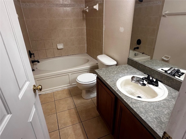 full bathroom featuring toilet, bathtub / shower combination, vanity, and tile patterned floors