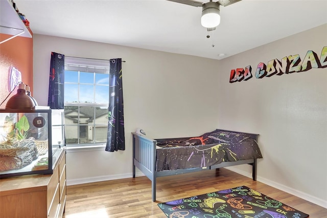 playroom with ceiling fan, plenty of natural light, and light hardwood / wood-style flooring