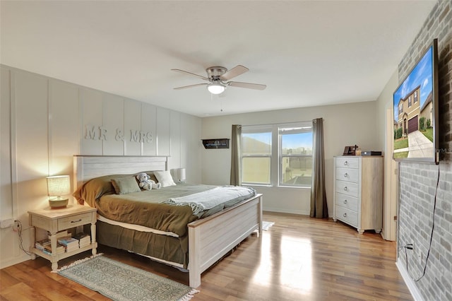 bedroom featuring ceiling fan and light hardwood / wood-style flooring