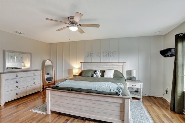 bedroom featuring ceiling fan and light hardwood / wood-style floors