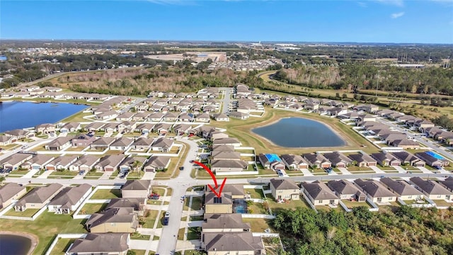 drone / aerial view featuring a water view