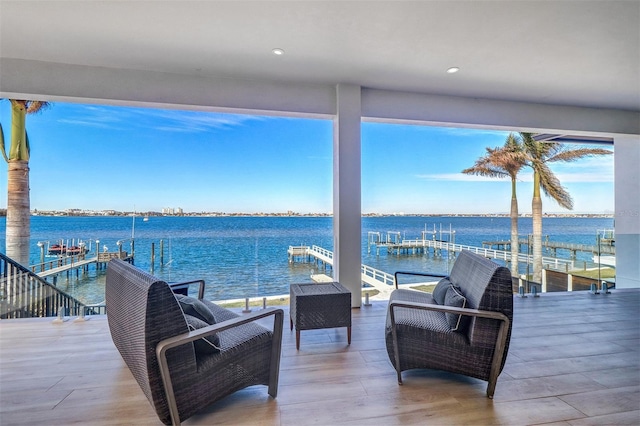 view of patio / terrace with a dock and a water view