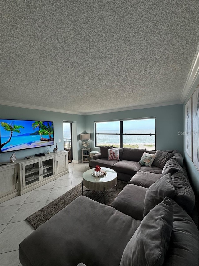 tiled living room featuring ornamental molding and a water view