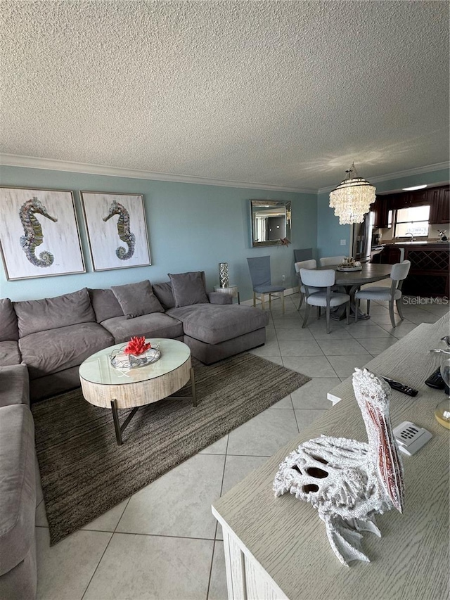 tiled living room with crown molding, a chandelier, and a textured ceiling