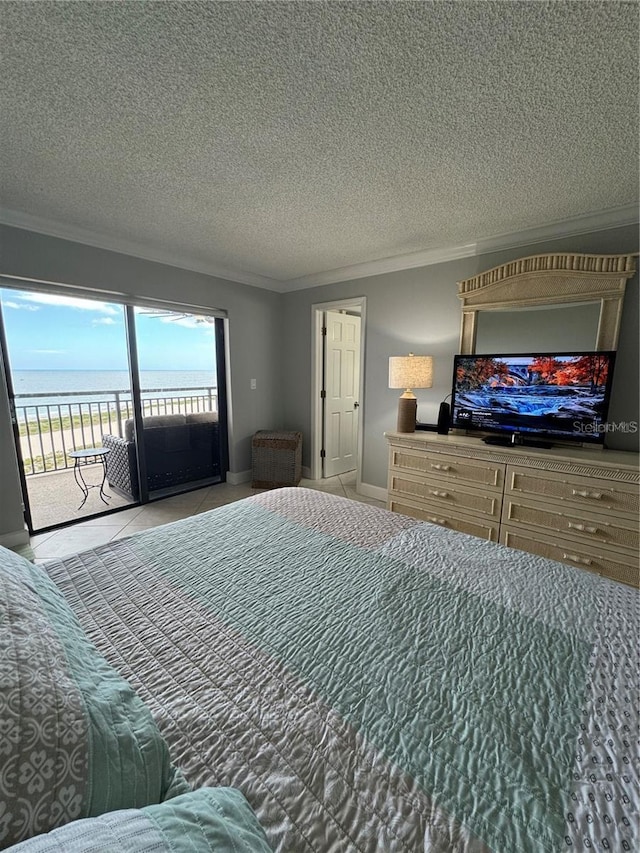 bedroom with a textured ceiling, crown molding, a water view, and access to outside