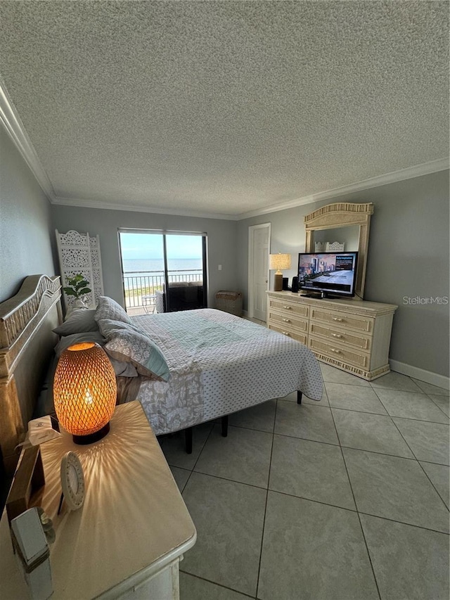 tiled bedroom with access to outside and ornamental molding