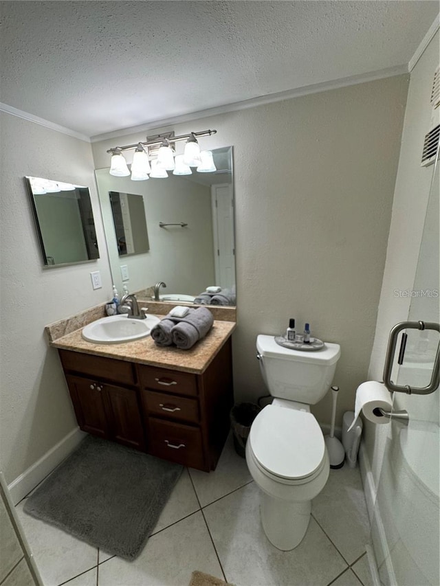 bathroom featuring a textured ceiling, tile patterned flooring, vanity, toilet, and crown molding