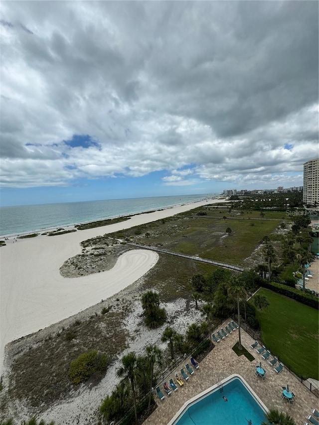 bird's eye view with a beach view and a water view