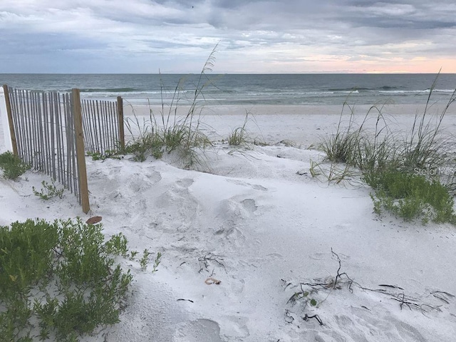 property view of water featuring a beach view