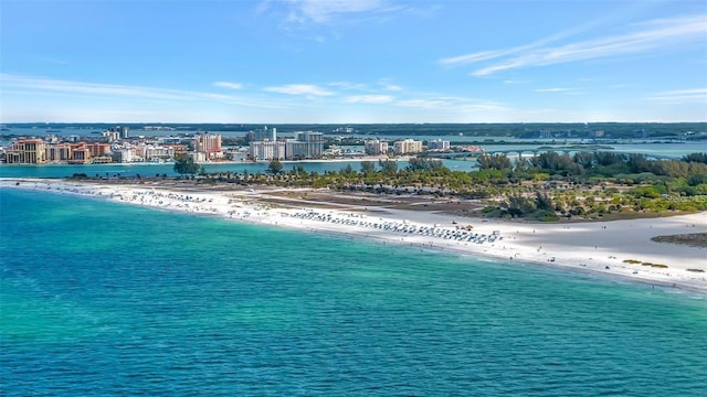 birds eye view of property with a water view and a view of the beach