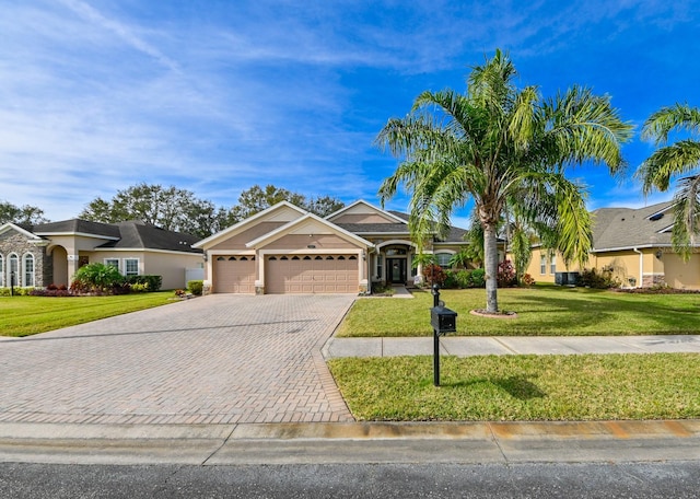 ranch-style home with a garage and a front yard