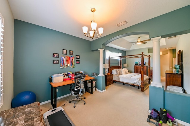 carpeted bedroom with a notable chandelier and ornate columns