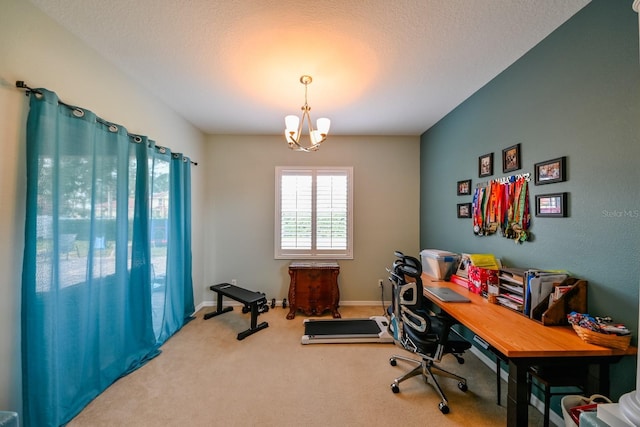 carpeted office featuring a textured ceiling and a chandelier