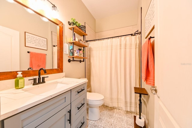 bathroom with vanity, toilet, walk in shower, and tile patterned floors