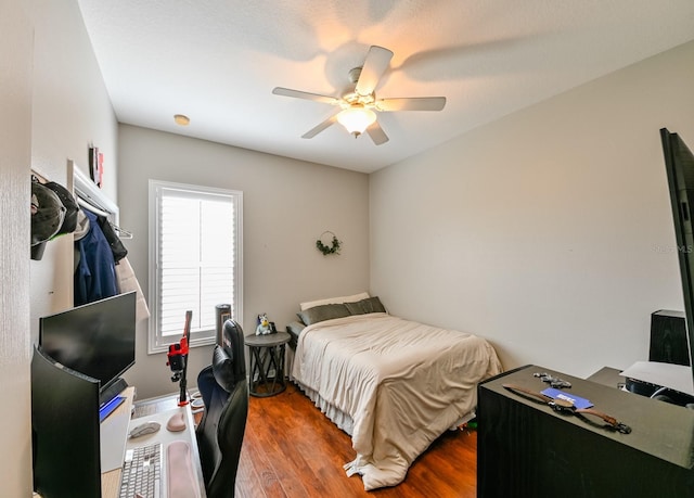 bedroom featuring ceiling fan and wood-type flooring