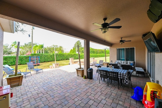 view of patio with ceiling fan and an outdoor hangout area