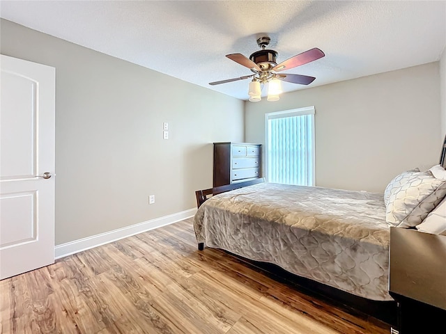 bedroom featuring ceiling fan and light wood-type flooring