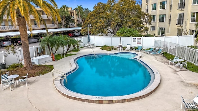 view of swimming pool with a patio