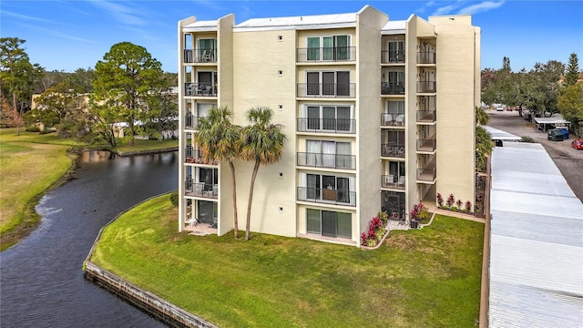 view of property with a water view