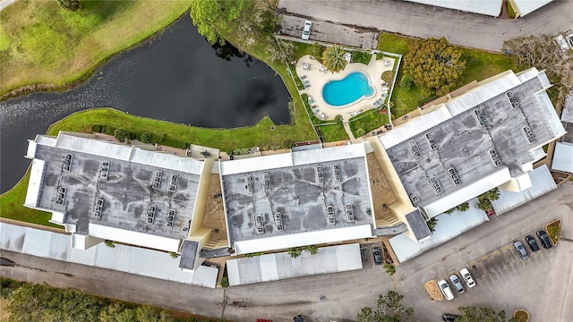 birds eye view of property with a water view