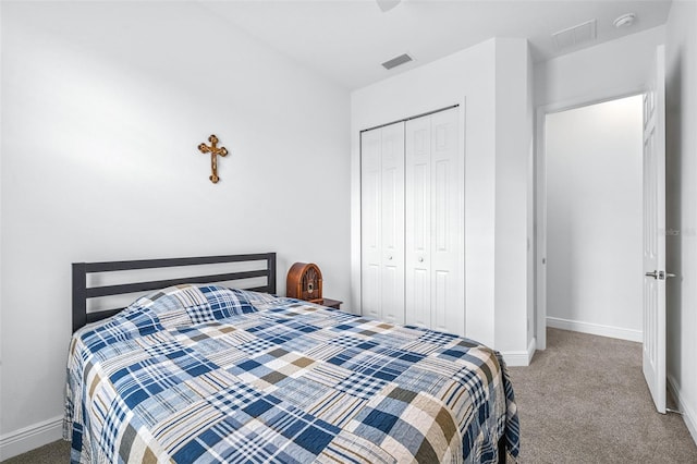 carpeted bedroom featuring a closet