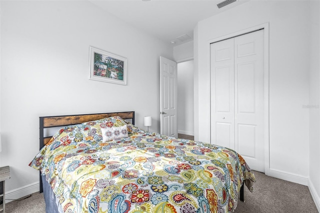 carpeted bedroom featuring a closet